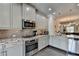 Modern kitchen with granite countertops, stainless steel appliances, and light gray cabinetry at 4007 Dunwoody Trce, Atlanta, GA 30338
