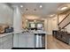 Open-concept kitchen with a view of the living area, granite countertops, and stainless appliances at 4007 Dunwoody Trce, Atlanta, GA 30338