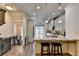 Bright kitchen with granite countertops, stainless steel appliances, breakfast bar, and open floor plan at 4007 Dunwoody Trce, Atlanta, GA 30338