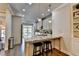 Bright kitchen features granite countertops, stainless steel appliances, and a breakfast bar with seating at 4007 Dunwoody Trce, Atlanta, GA 30338