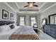 Main bedroom with trey ceiling, ceiling fan, carpeting, and many windows at 4007 Dunwoody Trce, Atlanta, GA 30338