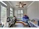 Bright room with hardwood floors, neutral walls, and a play kitchen and tent at 4007 Dunwoody Trce, Atlanta, GA 30338
