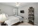This cozy bedroom features neutral colors and a large window for natural light at 5845 Shannon Dr, Cumming, GA 30040