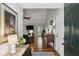 Welcoming foyer with hardwood floors, leading into a spacious living area with a fireplace and abundant natural light at 5845 Shannon Dr, Cumming, GA 30040