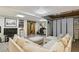 Versatile living space featuring a comfortable sectional, barn doors, and a neutral color palette at 5845 Shannon Dr, Cumming, GA 30040