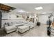 Spacious living room with plush sectional sofa, recessed lighting, and durable floors, ideal for relaxation and entertaining at 5845 Shannon Dr, Cumming, GA 30040