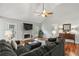 Cozy living room with hardwood floors, a fireplace, and access to the backyard, creating a warm and inviting atmosphere at 5845 Shannon Dr, Cumming, GA 30040