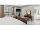Bright main bedroom features an ensuite bathroom, large window, and a trey ceiling at 5845 Shannon Dr, Cumming, GA 30040