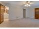 Large bedroom with carpet, ceiling fan, and an attached bathroom with vanity at 2198 Kings Forest Se Dr, Conyers, GA 30013