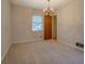 Bright bedroom with carpeted flooring, a ceiling fan, and a view of the entry door at 2198 Kings Forest Se Dr, Conyers, GA 30013