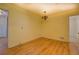 Bright dining room featuring hardwood floors and traditional light fixture at 2198 Kings Forest Se Dr, Conyers, GA 30013