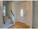 Inviting entryway with hardwood floors, decorative door, and staircase at 2198 Kings Forest Se Dr, Conyers, GA 30013