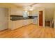 Well-lit kitchen with white cabinets, modern appliances, and hardwood floors at 2198 Kings Forest Se Dr, Conyers, GA 30013