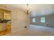 Open-concept living area featuring hardwood flooring and a seamless transition to the kitchen at 2198 Kings Forest Se Dr, Conyers, GA 30013