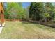 Large, level backyard with a well-manicured lawn and a wood fence that is perfect for outdoor activities at 3853 Coralberry Ct, Dacula, GA 30019
