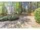 Spacious backyard is enclosed with a wood fence and features mature trees and landscaping at 3853 Coralberry Ct, Dacula, GA 30019