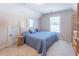 Cozy bedroom with a comfortable bed, complemented by natural light and simple decor for a relaxing retreat at 3853 Coralberry Ct, Dacula, GA 30019