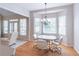 Inviting breakfast nook with large windows and a stylish chandelier at 3853 Coralberry Ct, Dacula, GA 30019