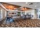 Elegant clubhouse interior with stylish furnishings, a stone fireplace, and coffered ceilings at 3853 Coralberry Ct, Dacula, GA 30019
