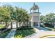 Inviting clubhouse with a tower, stone accents, and well-manicured landscaping at 3853 Coralberry Ct, Dacula, GA 30019