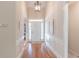 Elegant foyer showcasing hardwood floors, high ceilings, and decorative trim at 3853 Coralberry Ct, Dacula, GA 30019