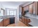 Spacious kitchen featuring wood floors, wood cabinets, and stainless steel appliances at 3853 Coralberry Ct, Dacula, GA 30019
