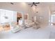 Open-concept living space with hardwood floors, natural light, and a seamless flow to the kitchen at 3853 Coralberry Ct, Dacula, GA 30019