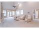 Spacious living room with vaulted ceilings and a cozy seating arrangement at 3853 Coralberry Ct, Dacula, GA 30019