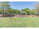 Playground at Little Mulberry Park with slides, climbing structures, and swings at 3853 Coralberry Ct, Dacula, GA 30019