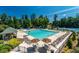 Resort-style pool area with ample lounge seating, umbrellas, and a poolside bar at 3853 Coralberry Ct, Dacula, GA 30019