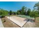 Recreational area featuring a sand volleyball court and basketball court under a clear sky at 3853 Coralberry Ct, Dacula, GA 30019