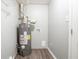 A utilitarian basement space features a newer model water heater and gray, vinyl floors at 3905 Kirksford Dr, Decatur, GA 30035