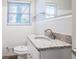Bathroom vanity features a granite countertop, stainless steel faucet, and tiled walls at 3905 Kirksford Dr, Decatur, GA 30035