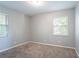 Spacious bedroom with two windows and neutral colored walls and carpeting at 3905 Kirksford Dr, Decatur, GA 30035