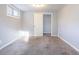 Cozy bedroom with neutral carpet, light gray walls, and natural light from the window at 3905 Kirksford Dr, Decatur, GA 30035