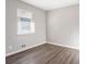 The bedroom features wood floors, neutral walls, and a window with blinds at 3905 Kirksford Dr, Decatur, GA 30035