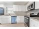 Bright kitchen features white cabinets, granite countertops, and stainless steel appliances at 3905 Kirksford Dr, Decatur, GA 30035