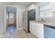 Updated kitchen with white cabinets, stainless steel refrigerator, and granite countertops at 3905 Kirksford Dr, Decatur, GA 30035