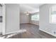 Spacious living room with wood flooring, a modern ceiling fan, and neutral gray walls at 3905 Kirksford Dr, Decatur, GA 30035