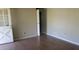 A clean bedroom with laminate floors and a standard door to hallway or closet at 8317 Marlborough Dr, Jonesboro, GA 30238