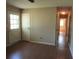 Hallway with wood-look flooring and natural light from the exterior door at 8317 Marlborough Dr, Jonesboro, GA 30238
