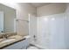 Bathroom featuring a granite vanity and sink, and white tiled shower and tub at 2800 Macon Se Dr, Atlanta, GA 30354