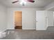 Bedroom featuring a ceiling fan and carpet, with an open door to another room at 2800 Macon Se Dr, Atlanta, GA 30354