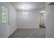 Dining area featuring a new carpet and a door leading to outside at 2800 Macon Se Dr, Atlanta, GA 30354