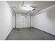 Clean, empty garage featuring a modern garage door opener and smooth concrete floor at 2800 Macon Se Dr, Atlanta, GA 30354