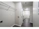 Functional laundry room with overhead storage and convenient utility connections at 2800 Macon Se Dr, Atlanta, GA 30354