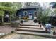 Cozy backyard featuring a deck, outdoor seating, and lush landscaping at 2800 Memorial Se Dr, Atlanta, GA 30317