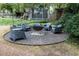 Backyard with a firepit, chairs, and a playhouse, great for entertaining at 2800 Memorial Se Dr, Atlanta, GA 30317