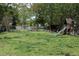 Large backyard with playground equipment, garden beds, and a wooden fence at 2800 Memorial Se Dr, Atlanta, GA 30317