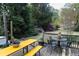 Well-maintained backyard featuring a deck, outdoor seating, and lush greenery at 2800 Memorial Se Dr, Atlanta, GA 30317